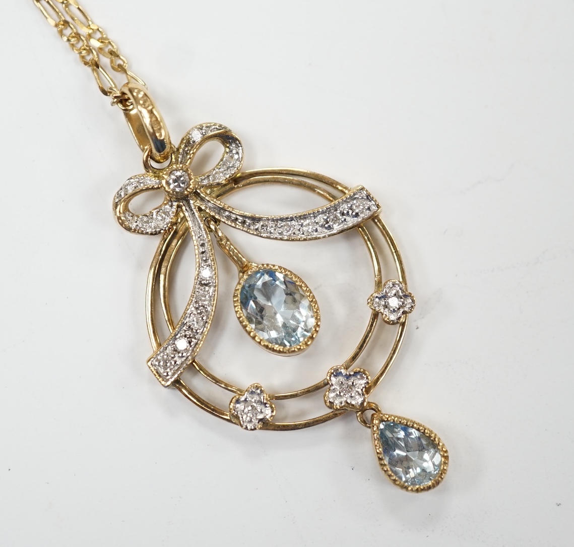 A modern 9ct gold, aquamarine and diamond cluster set drop pendant necklace, pendant 40mm, chain, 44cm, gross weight 5.2 grams. Good condition.